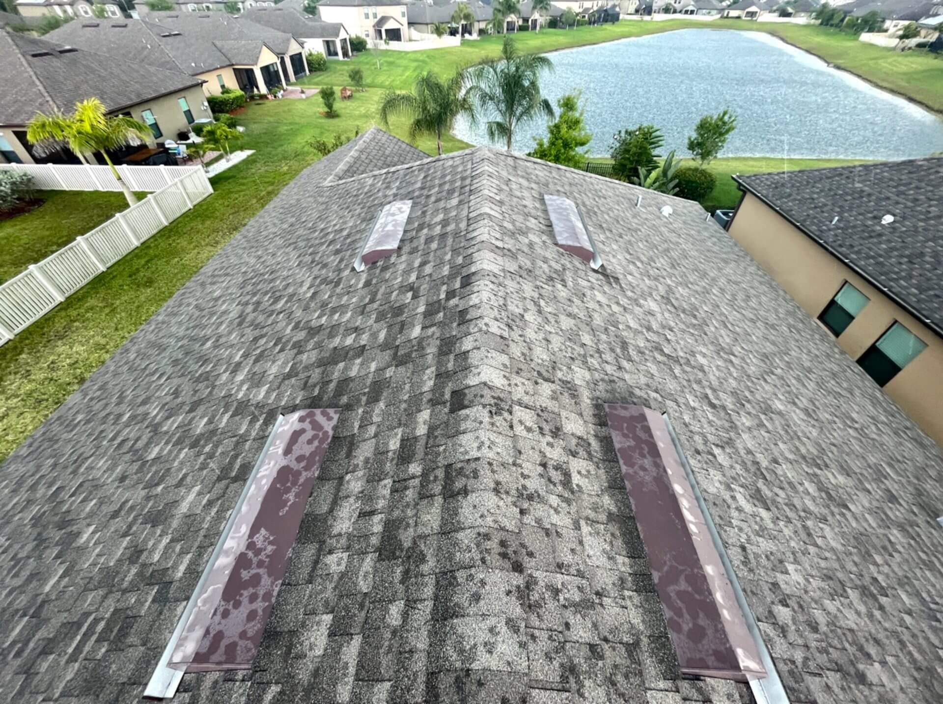 Shingle roof towards rear of home taken from standing on roof.